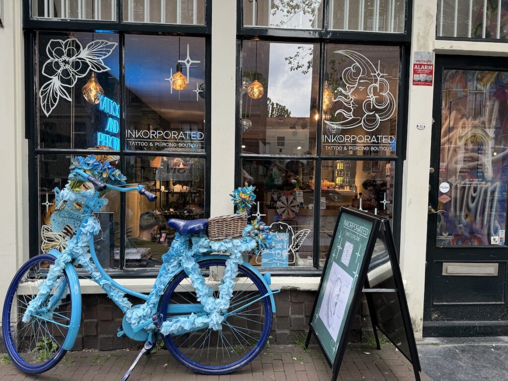 Decorated Bicycle Outside an Amsterdam Boutique Decorated blue bicycle outside a boutique in Amsterdam